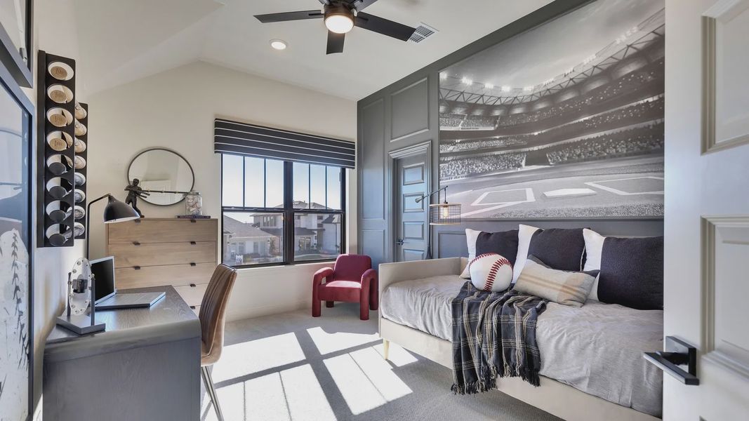 Elegant bedroom features a striking baseball mural, plush daybed, and chic decor in Flora community.