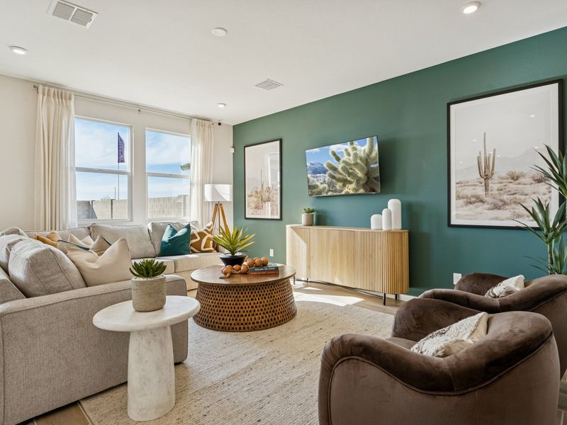 A living room with a green wall.