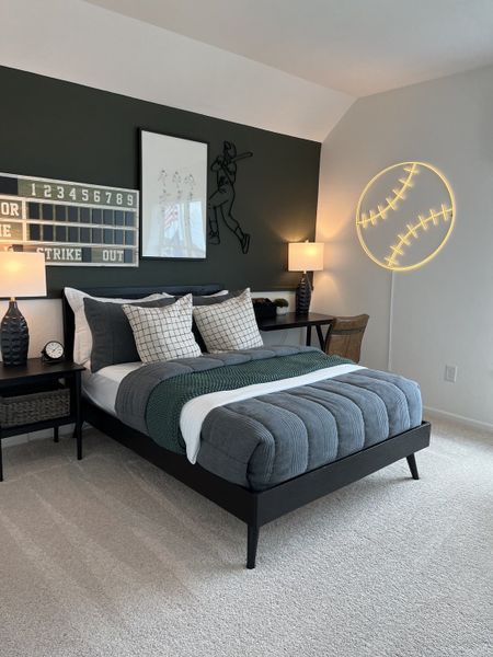 A cozy bedroom with a baseball theme, featuring modern decor, a sleek bed, and ambient lighting.