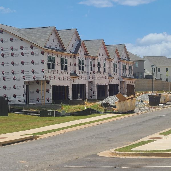 New townhomes under construction with a modern design in Sandtown Falls by Rockhaven Homes (Atlanta, GA). New townhomes under construction with a modern design in Sandtown Falls by Rockhaven Homes (Atlanta, GA).