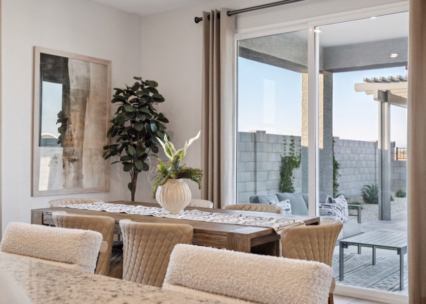 A living room with a large window. A living room with a large window.