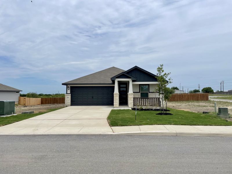 A modern single-story home with a stone façade and tidy yard in Royal Crest by Meritage Homes, San Antonio, TX. A modern single-story home with a stone façade and tidy yard in Royal Crest by Meritage Homes, San Antonio, TX.