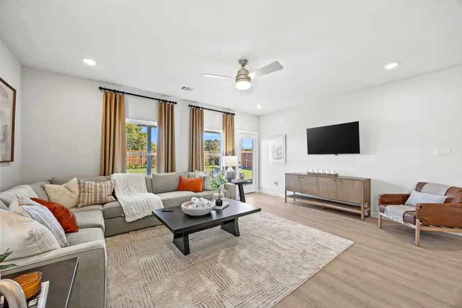 A living room with a tv and couches.