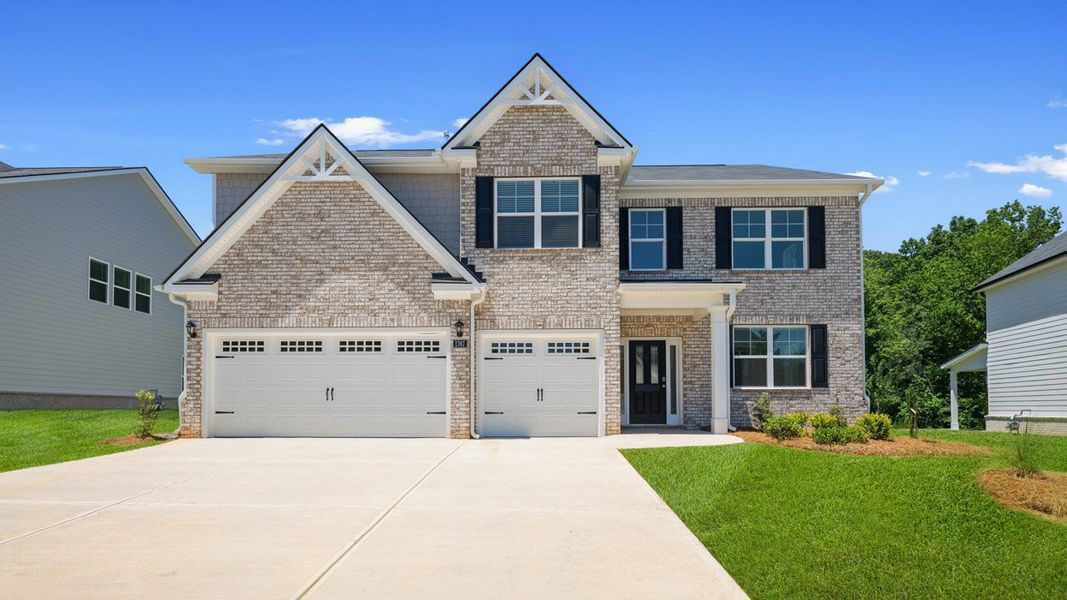 Front exterior of a home in the The Gates at Pates Creek community, located in Hampton, GA (Image 4).