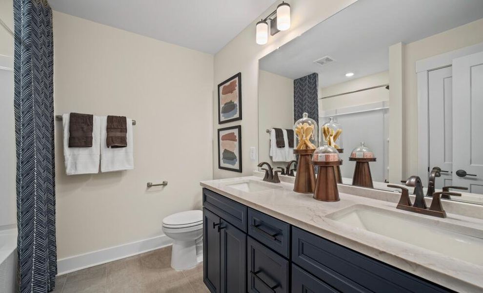 Furnished interior in a model home at Twin Creek Forsyth in Kernersville (Image 17).