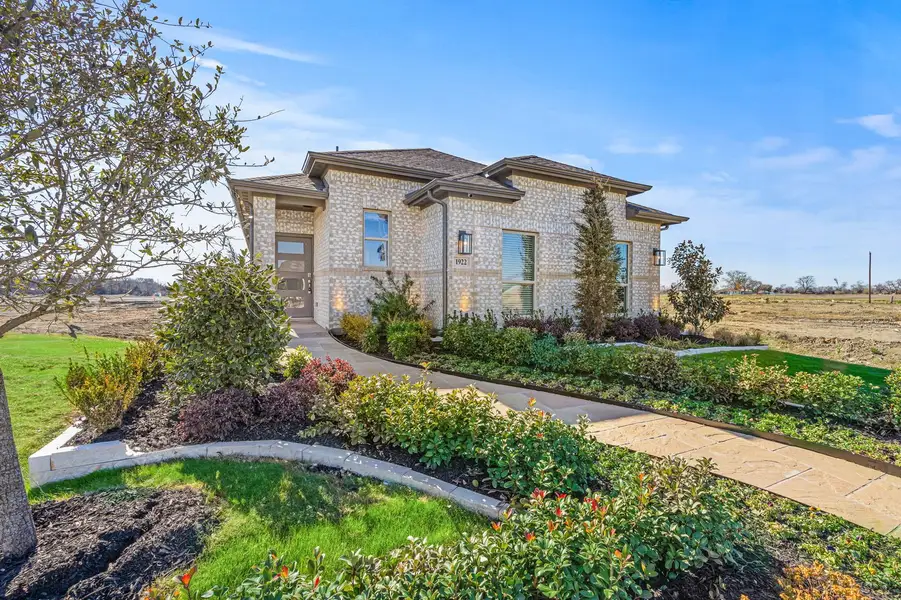 Front exterior of a home in the Creekside Ranch community, located in Blue Ridge, TX (Image 5).
