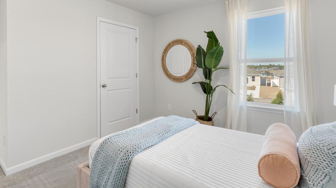 Furnished interior in a model home at The Grove at Blake Farm in Wilmington (Image 36). Furnished interior in a model home at The Grove at Blake Farm in Wilmington (Image 36).