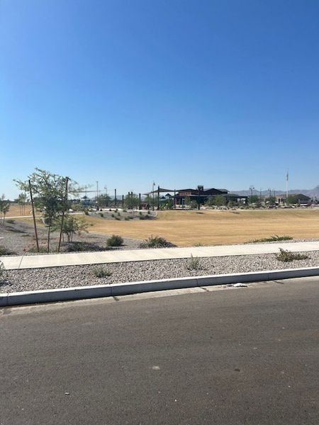 A scenic view with open landscapes and a modern community center in Silva Farms by Meritage Homes (Goodyear, AZ). A scenic view with open landscapes and a modern community center in Silva Farms by Meritage Homes (Goodyear, AZ).