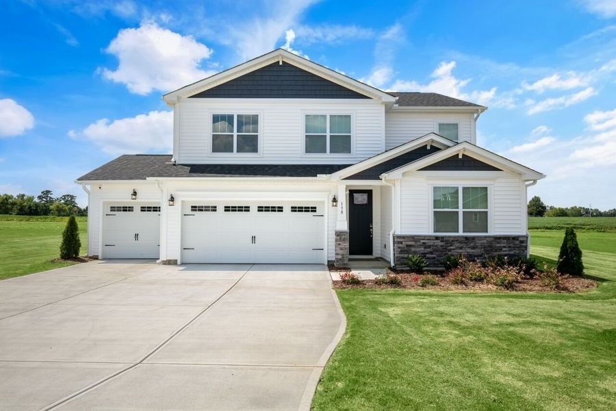 Front exterior of a home in the Clarabella community, located in Fuquay Varina, NC (Image 1).