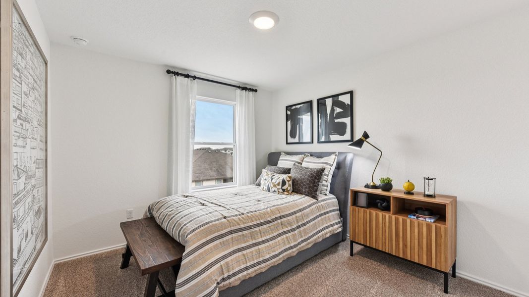 Furnished interior in a model home at Palomino in Manor (Image 42).