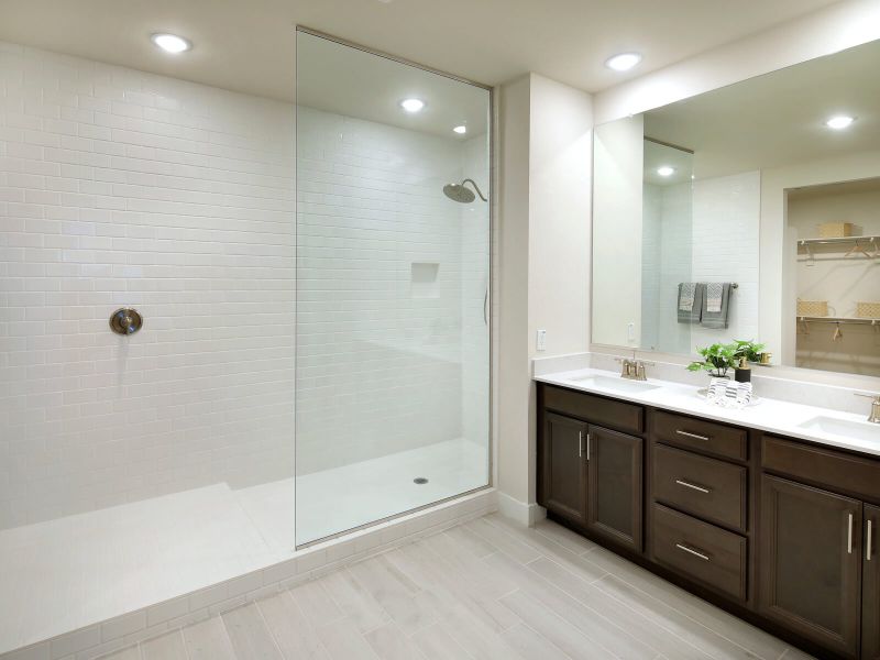 Enjoy the spa-like design of the primary suite bathroom.