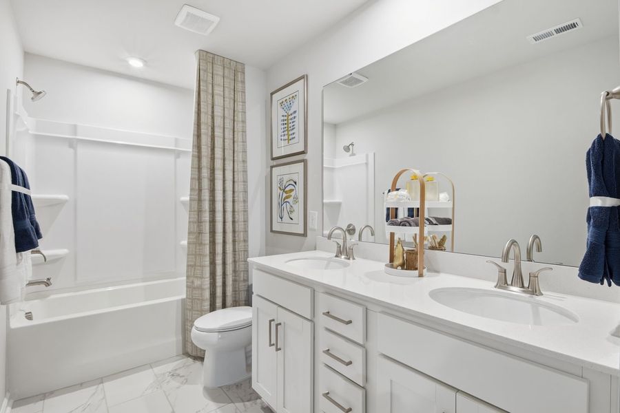 Furnished interior in a model home at Clairmont in Charlotte (Image 23).