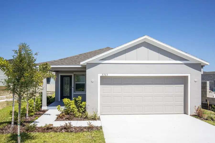 Front exterior of a home in the Hammock Reserve community, located in Haines City, FL (Image 4).