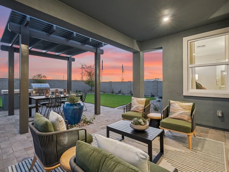 A patio with a table and chairs. A patio with a table and chairs.