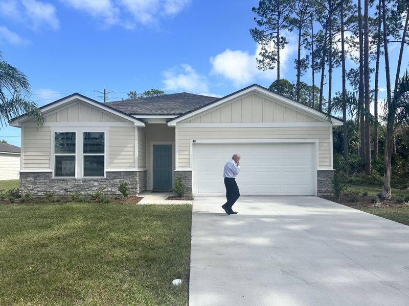 Front exterior of a home in the Palm Coast community, located in Palm Coast, FL (Image 9).
