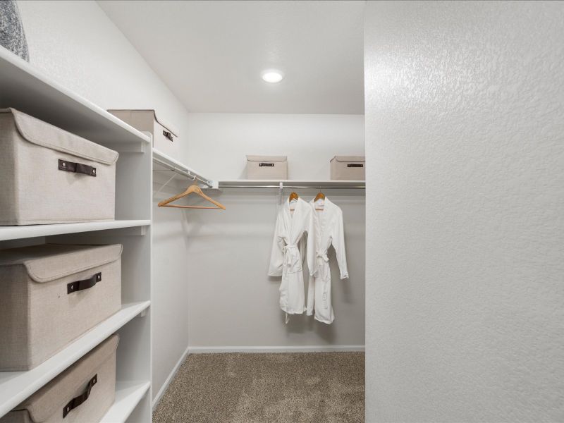 Furnished interior in a model home at Frontier Estates - The Trails Collection in Firestone (Image 11).