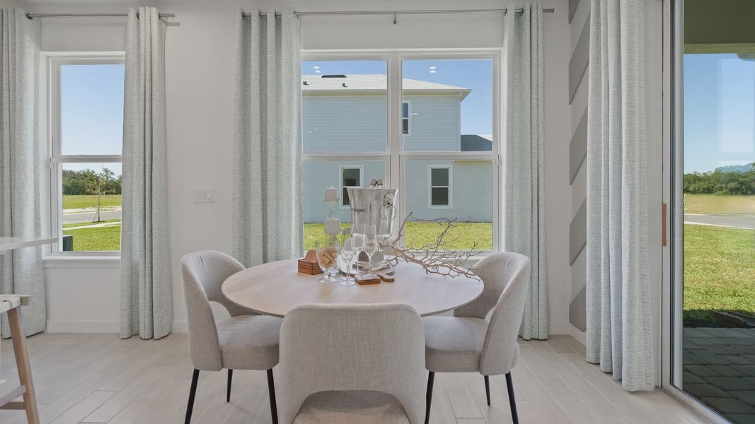 Dining room filled with natural light, creating a warm and welcoming space for meals at DRB homes
