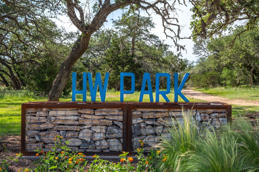 Entrance to the Headwaters 60' - Executive Series community in Dripping Springs, TX, featuring signage and landscaping (Image 5).