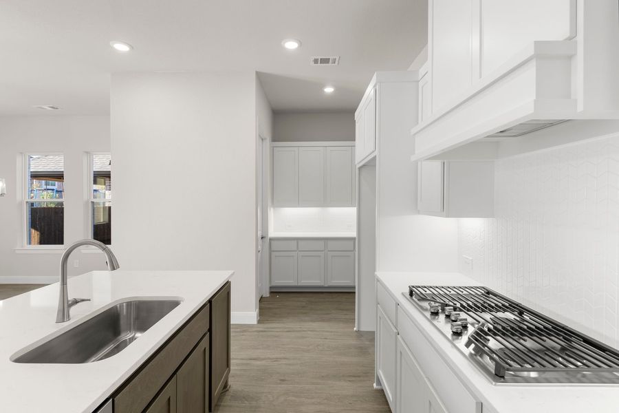 Furnished interior in a model home at West Crossing in Anna (Image 17).