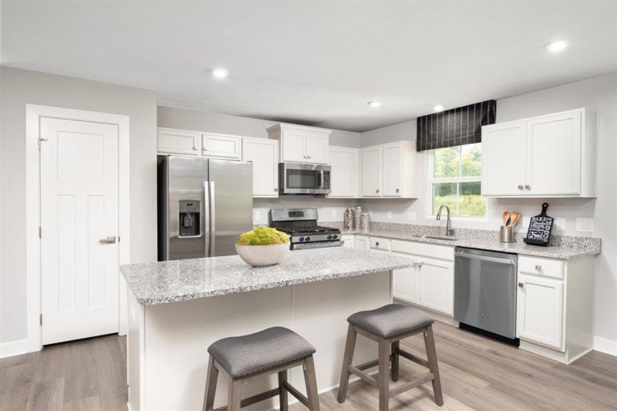 Furnished interior in a model home at Lakes At Riverbend Ranches in Navassa (Image 5).