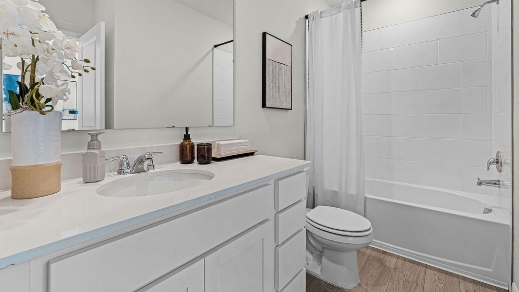 Furnished interior in a model home at Fish Lake Cove in Kissimmee (Image 11).