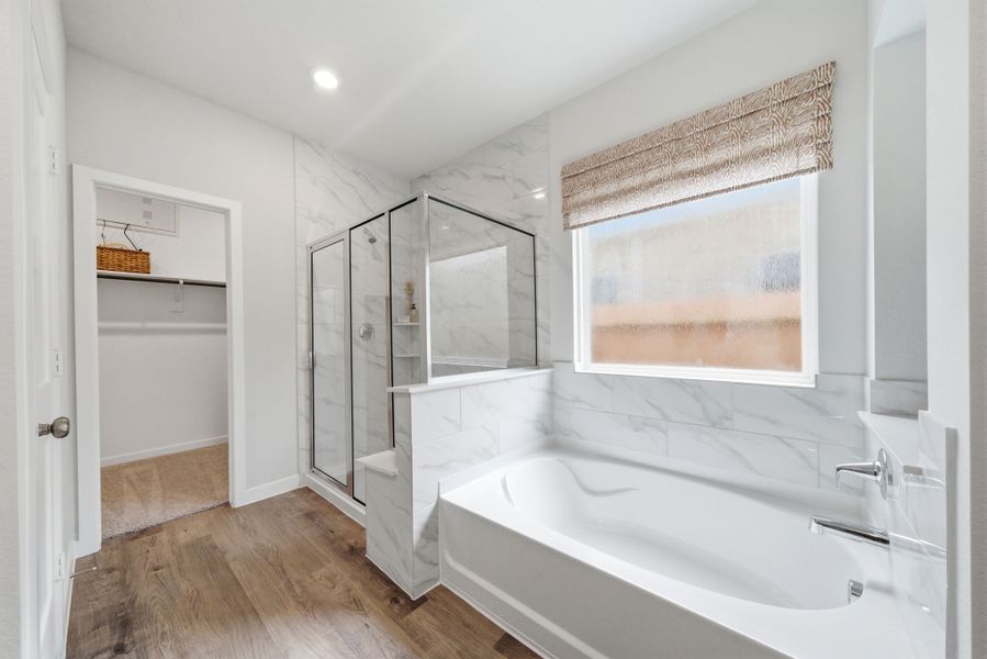 A bathroom with a tub and sink.