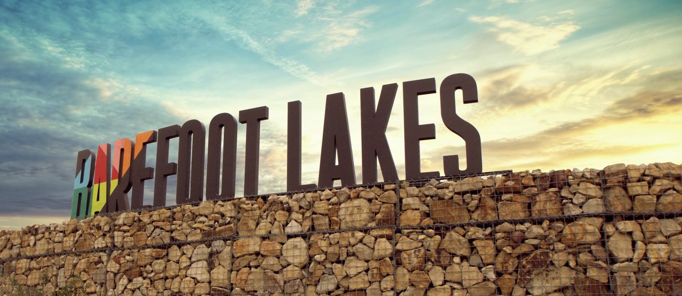 Entrance to the Barefoot Lakes community in Longmont, CO, featuring signage and landscaping (Image 1). Entrance to the Barefoot Lakes community in Longmont, CO, featuring signage and landscaping (Image 1).