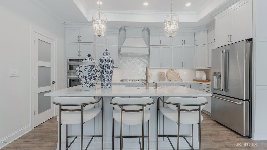 Furnished interior in a model home at The Courtyards at Redbud Lane in Holly Springs (Image 24).