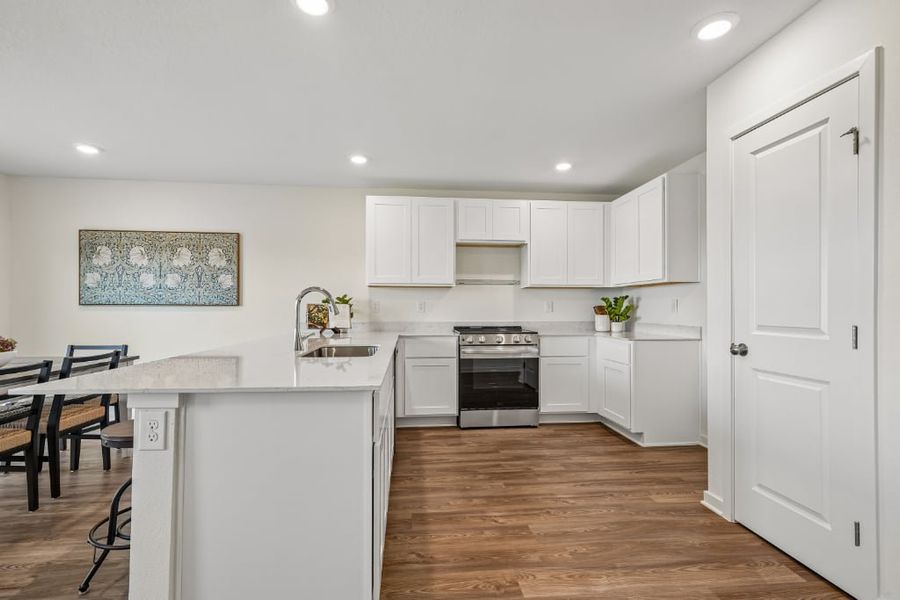 A kitchen with white cabinets. A kitchen with white cabinets.