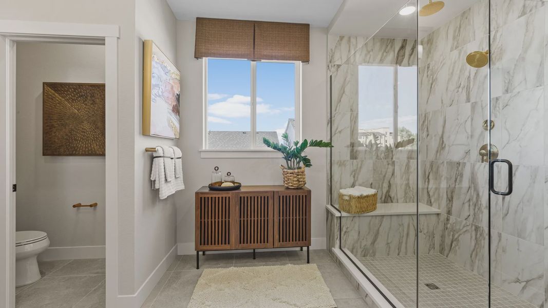 Indulge in this Dillon Pointe retreat with elegant marble shower, sleek wood finishes, and panoramic views. Indulge in this Dillon Pointe retreat with elegant marble shower, sleek wood finishes, and panoramic views.
