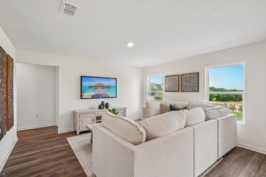 A living room with a white couch. A living room with a white couch.