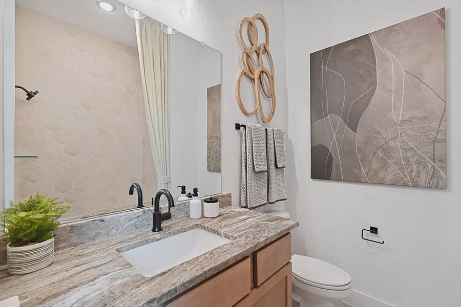 Furnished interior in a model home at Brookewater 60's in Rosenberg (Image 20).