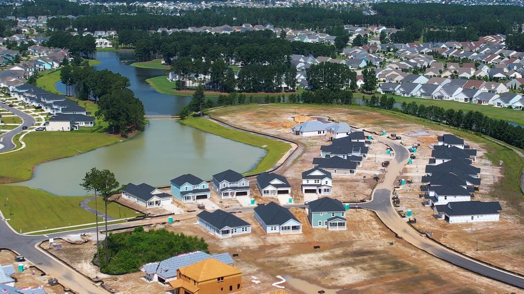 Aerial view of the The Coves at Lakes of Cane Bay community in Summerville, SC, showing layout and nearby surroundings (Image 13). Aerial view of the The Coves at Lakes of Cane Bay community in Summerville, SC, showing layout and nearby surroundings (Image 13).