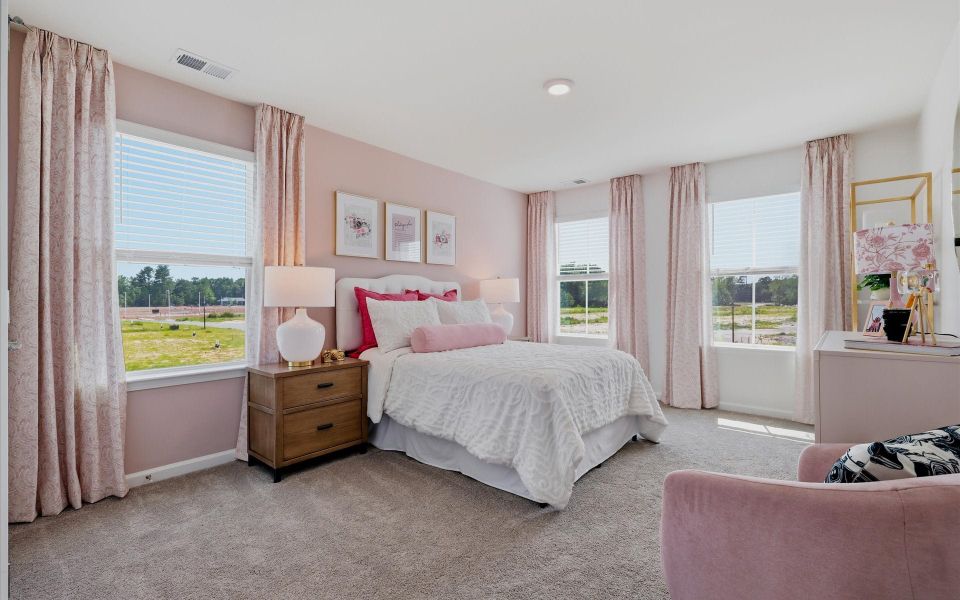 Furnished interior in a model home at Riverwalk Pointe at Mallory Creek - Townhomes in Leland (Image 23). Furnished interior in a model home at Riverwalk Pointe at Mallory Creek - Townhomes in Leland (Image 23).