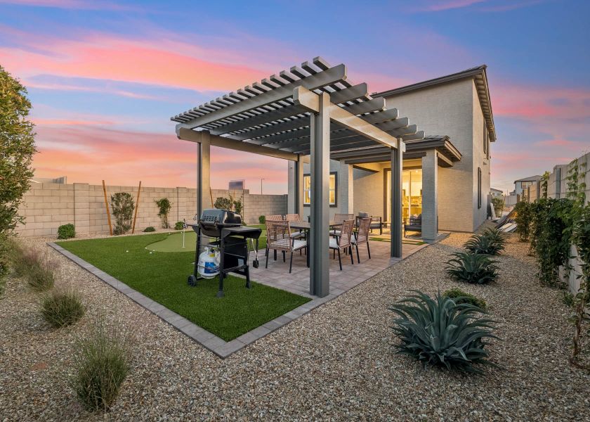 A house with a patio and a pool. A house with a patio and a pool.