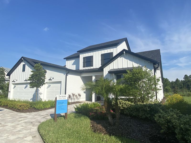 A modern white home with a spacious yard in Del Webb Saint Johns by Del Webb (St. Johns, FL).