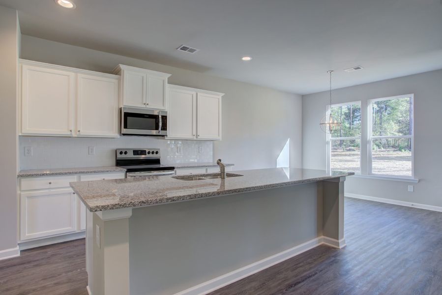 Furnished interior in a model home at Legends at Old Monroe in Monroe (Image 30).