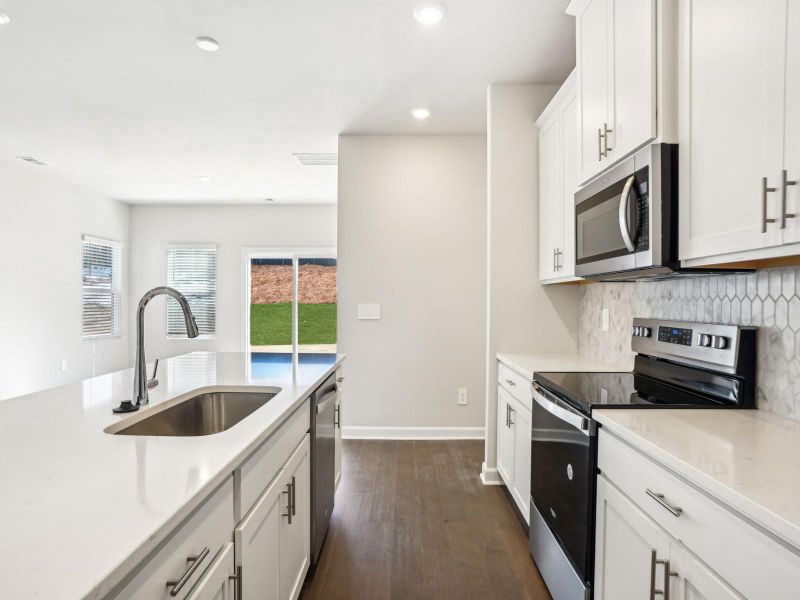 Furnished interior in a model home at Russell Grove - Rolling Hills Series in Charlotte (Image 5).