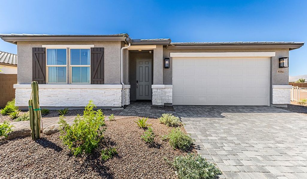 Front exterior of a home in the Portfolio at White Tank Foothills community, located in Waddell, AZ (Image 10).