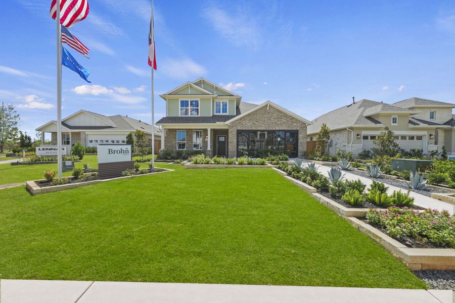 Front exterior of a home in the Grand Magnolia community, located in Magnolia, TX (Image 2).