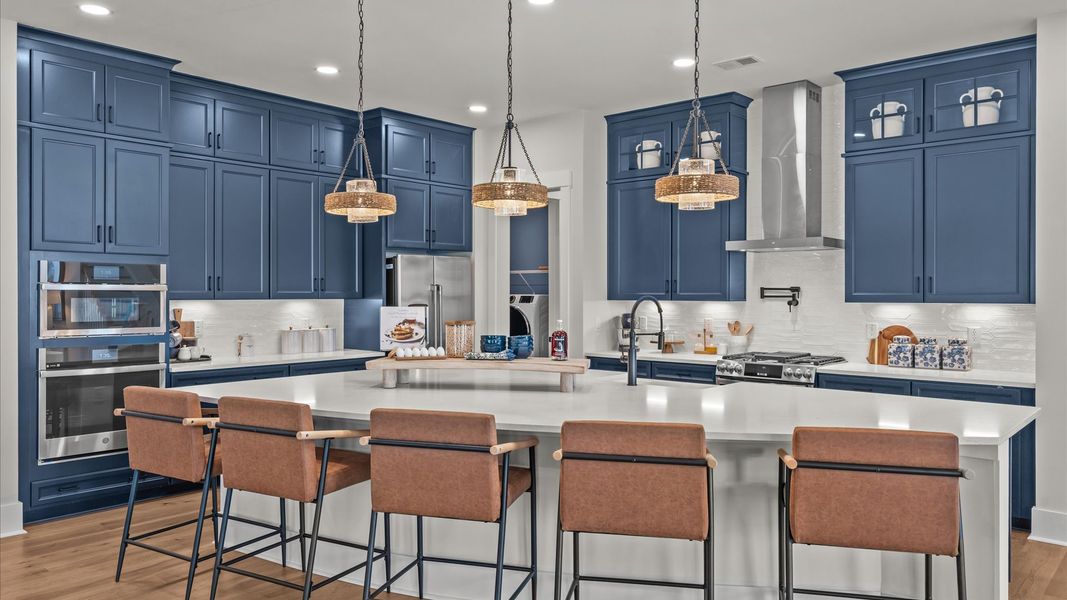 Inspire Kitchen with large island and blue cabinetry
