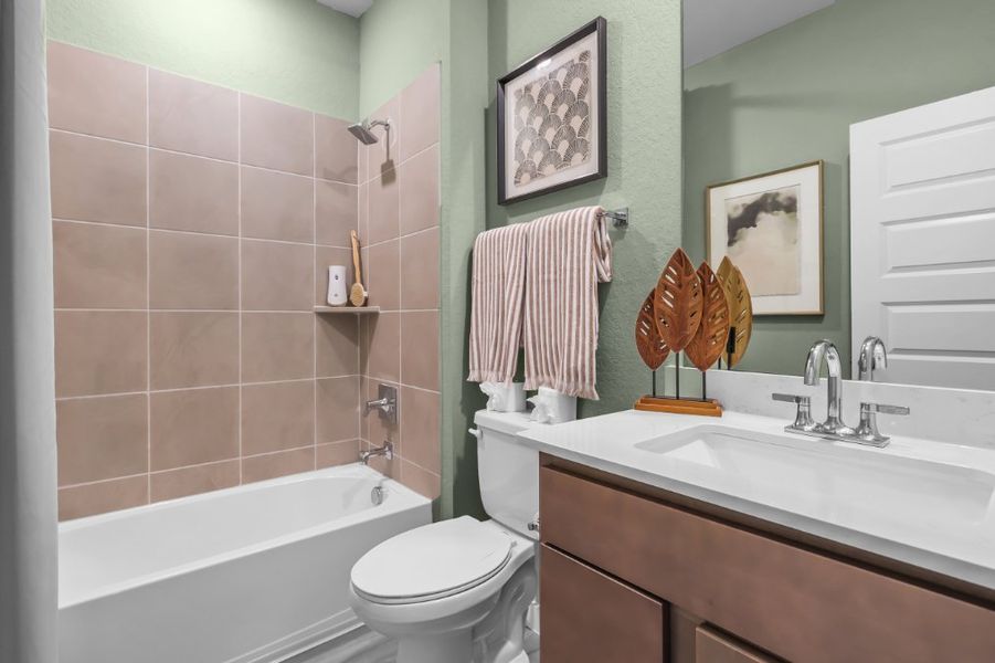 A bathroom with a toilet and sink. A bathroom with a toilet and sink.