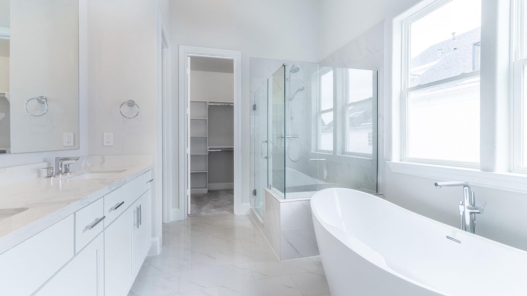 Furnished interior in a model home at Upper East River in Houston (Image 17).