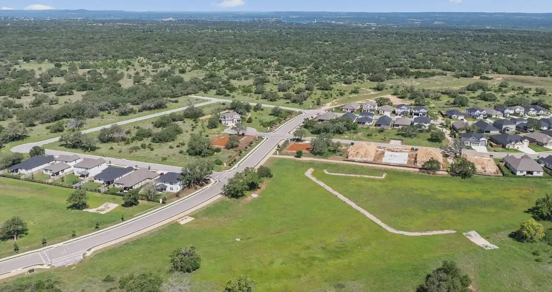 Aerial view of the Gregg Ranch community in Marble Falls, TX, showing layout and nearby surroundings (Image 14).