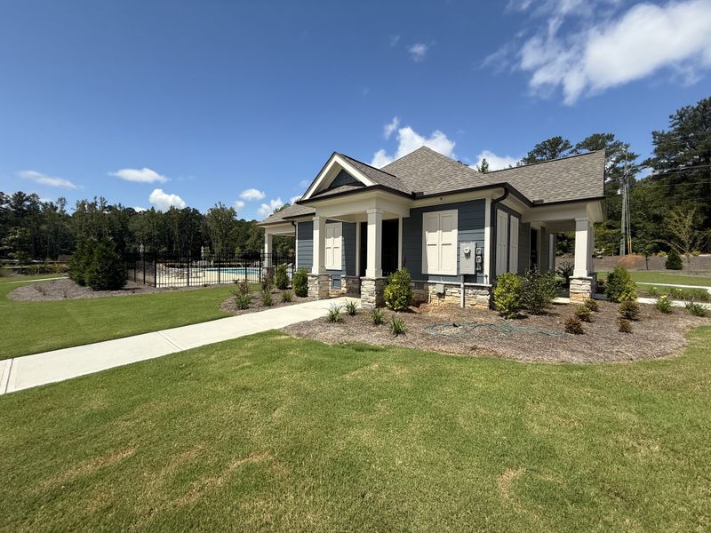 A charming cottage with a landscaped yard and pool area in Candleberry Place by Lennar (Sharpsburg, GA).