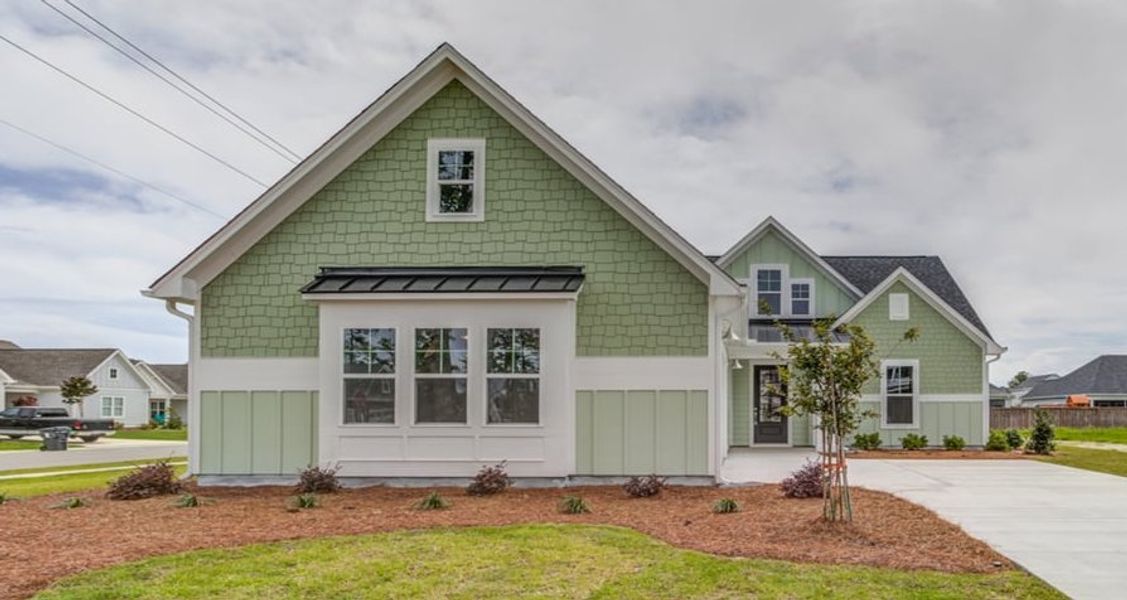 Front exterior of a home in the WyndWater community, located in Hampstead, NC (Image 2).