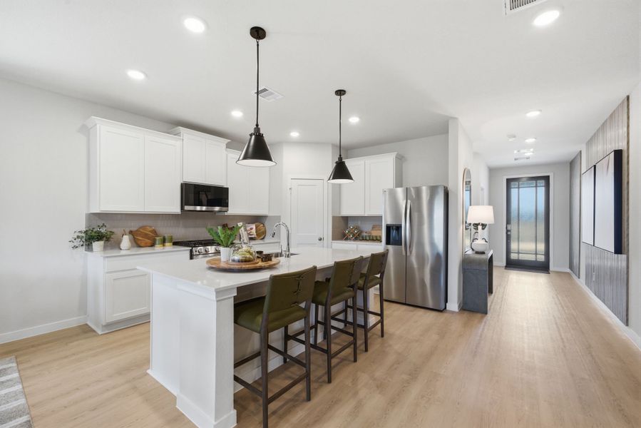A kitchen with white cabinets. A kitchen with white cabinets.