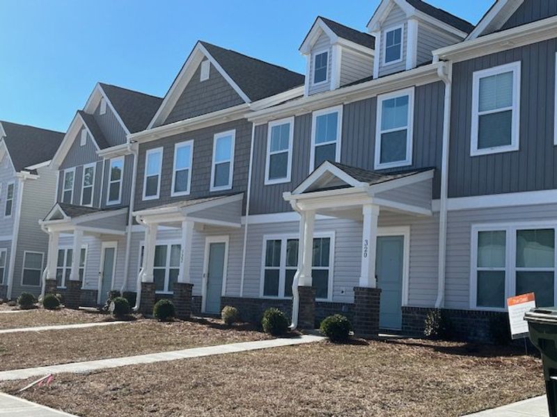 Charming row of modern townhomes in North Creek at Nexton by True Homes, Summerville, SC.