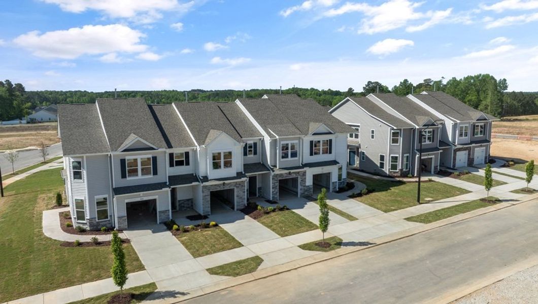 Aerial view of the Chapel Townes community in Raleigh, NC, showing layout and nearby surroundings (Image 13). Aerial view of the Chapel Townes community in Raleigh, NC, showing layout and nearby surroundings (Image 13).