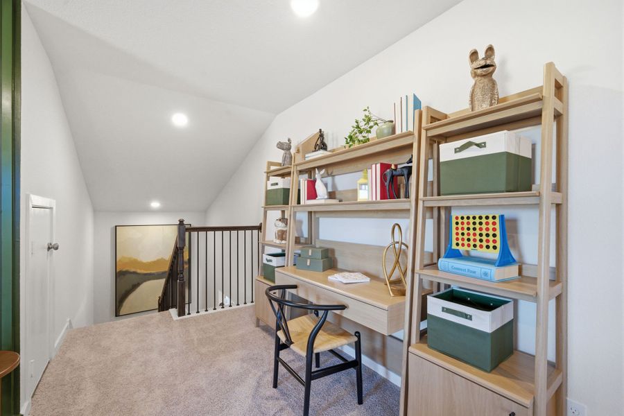 A room with a desk and shelves. A room with a desk and shelves.